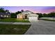 Charming single-Gathering home featuring a well-maintained lawn and attached two-car garage at 7243 Minippi Dr, Orlando, FL 32818