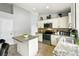Bright kitchen featuring granite countertops, stainless steel appliances, with a functional center island at 7243 Minippi Dr, Orlando, FL 32818