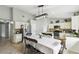 Open-concept kitchen and dining featuring tile flooring, stainless steel appliances, and white cabinetry at 7243 Minippi Dr, Orlando, FL 32818