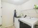Functional laundry room includes modern washer and dryer with plenty of space to move at 7243 Minippi Dr, Orlando, FL 32818