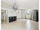 Spacious living room featuring tile flooring, vaulted ceilings, and elegant decor at 7243 Minippi Dr, Orlando, FL 32818