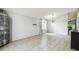 Spacious living room with tile flooring, vaulted ceilings, and lots of natural light at 7243 Minippi Dr, Orlando, FL 32818