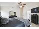 Comfortable main bedroom featuring ceramic tile flooring, a ceiling fan and easy access to ensuite at 7243 Minippi Dr, Orlando, FL 32818