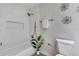 A serene bathroom features a tub and shower combination with brushed gold accents and soft lighting at 822 Glen Arden Way, Altamonte Springs, FL 32701