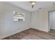 Cozy bedroom with a window, closet and wood-look floors, creating a comfortable space at 822 Glen Arden Way, Altamonte Springs, FL 32701