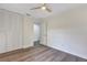 Bright bedroom featuring wood-look floors, a ceiling fan and a large closet for ample storage at 822 Glen Arden Way, Altamonte Springs, FL 32701