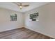 Well-lit bedroom with dual windows and wood-look floors for a bright and airy feel at 822 Glen Arden Way, Altamonte Springs, FL 32701