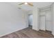 A bright room shows a closet for storage, modern fan, and vinyl flooring at 822 Glen Arden Way, Altamonte Springs, FL 32701