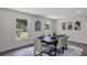 This dining room has natural light, wood-style flooring and a modern chandelier at 822 Glen Arden Way, Altamonte Springs, FL 32701