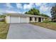 Wide driveway to a charming single-story home featuring a well-manicured lawn at 822 Glen Arden Way, Altamonte Springs, FL 32701