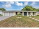 Charming single-story home featuring a well-manicured lawn and a welcoming double-door entryway at 822 Glen Arden Way, Altamonte Springs, FL 32701