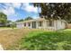 Attractive home featuring a lush front lawn, fresh exterior paint, shuttered windows, and double door entryway at 822 Glen Arden Way, Altamonte Springs, FL 32701