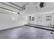 Spacious garage with white painted walls, concrete floors, and a Chamberlain garage door opener at 822 Glen Arden Way, Altamonte Springs, FL 32701