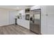 Well-lit kitchen featuring stainless steel appliances, white cabinets, and marble backsplash at 822 Glen Arden Way, Altamonte Springs, FL 32701