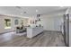 A spacious open-concept kitchen, with stainless appliances and a clear view to the dining area at 822 Glen Arden Way, Altamonte Springs, FL 32701
