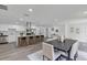 Bright open kitchen with island, stainless appliances, a modern range hood, and lots of cabinets at 822 Glen Arden Way, Altamonte Springs, FL 32701