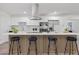 Bright open kitchen with island, stainless appliances, a modern range hood, and lots of cabinets at 822 Glen Arden Way, Altamonte Springs, FL 32701