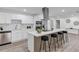 Bright open kitchen with island, stainless appliances, a modern range hood, and lots of cabinets at 822 Glen Arden Way, Altamonte Springs, FL 32701