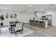 Bright open kitchen with island, stainless appliances, a modern range hood, and lots of cabinets at 822 Glen Arden Way, Altamonte Springs, FL 32701