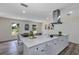 Modern eat-in kitchen boasts white cabinets, quartz countertops, and stainless steel appliances at 822 Glen Arden Way, Altamonte Springs, FL 32701