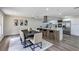 Beautiful dining area and open kitchen with stainless steel appliances, island seating, and stylish decor at 822 Glen Arden Way, Altamonte Springs, FL 32701
