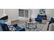 Charming living room featuring a vintage white fireplace and elegant blue furniture accents at 822 Glen Arden Way, Altamonte Springs, FL 32701