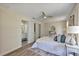 Relaxing bedroom with adjoining bathroom and calming neutral tones and wood look floors at 822 Glen Arden Way, Altamonte Springs, FL 32701