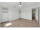 Spacious bedroom with hardwood floors, a ceiling fan, and large closets at 8812 Oakwood Dr, Lake Wales, FL 33898