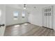 Spacious bedroom with hardwood floors, two windows for natural light, and large closets at 8812 Oakwood Dr, Lake Wales, FL 33898
