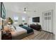 Bedroom featuring neutral walls, a ceiling fan, and a comfortable bed with an accent blanket at 8812 Oakwood Dr, Lake Wales, FL 33898