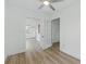 Spacious bedroom with hardwood floors, multiple entrances, including one with glass-paned doors at 8812 Oakwood Dr, Lake Wales, FL 33898