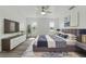 Bedroom with a ceiling fan and a large bed, and windows offering natural light at 8812 Oakwood Dr, Lake Wales, FL 33898