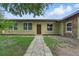 Charming single-story home with a stone-accented side and a welcoming front entrance at 8812 Oakwood Dr, Lake Wales, FL 33898
