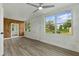 Sunroom featuring wood paneling, white textured walls, and natural light at 8812 Oakwood Dr, Lake Wales, FL 33898