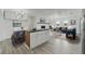 Open concept living area with modern furnishings, fireplace, and dining area adjacent to the kitchen island at 8812 Oakwood Dr, Lake Wales, FL 33898