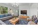 Comfortable living room with a large window, modern decor, and inviting seating at 8812 Oakwood Dr, Lake Wales, FL 33898