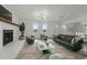 Modern living room boasts stylish decor, a cozy fireplace, and comfortable seating at 8812 Oakwood Dr, Lake Wales, FL 33898