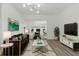 Modern living room boasts stylish decor, a comfortable seating area, and seamless access to other areas at 8812 Oakwood Dr, Lake Wales, FL 33898