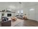 Bright living room featuring a fireplace, modern decor, and a comfortable seating area at 8812 Oakwood Dr, Lake Wales, FL 33898