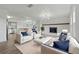 Bright living room features modern furniture, stylish lighting, and a cozy fireplace, creating an inviting atmosphere at 8812 Oakwood Dr, Lake Wales, FL 33898