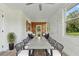 Inviting patio features a long dining table, comfortable seating, and bright sunlight at 8812 Oakwood Dr, Lake Wales, FL 33898