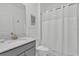 Bathroom features a modern vanity, a shower, and white fixtures at 9239 Sommerset Hills Dr, Davenport, FL 33896