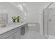This modern bathroom features double sinks, soaking tub, and glass-enclosed shower at 9239 Sommerset Hills Dr, Davenport, FL 33896