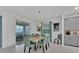 Inviting dining area featuring an elegant table set, stylish chairs and sliding glass door at 9239 Sommerset Hills Dr, Davenport, FL 33896