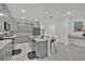 Bright kitchen features gray cabinetry, stainless steel appliances, a center island and stylish countertops at 9239 Sommerset Hills Dr, Davenport, FL 33896