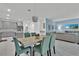 Open living space features modern kitchen, dining area, and comfortable seating at 9239 Sommerset Hills Dr, Davenport, FL 33896