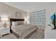 Cozy bedroom features a comfortable bed, soft lighting and elegant décor at 9239 Sommerset Hills Dr, Davenport, FL 33896