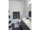 Bright bathroom featuring a new vanity, modern fixtures, white walls and neutral-toned decor at 9471 Comeau St, Gotha, FL 34734