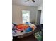 Comfortable bedroom featuring a ceiling fan, and natural light from the window at 9471 Comeau St, Gotha, FL 34734