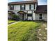 Charming townhouse featuring a well-manicured lawn and a welcoming covered entryway at 9471 Comeau St, Gotha, FL 34734